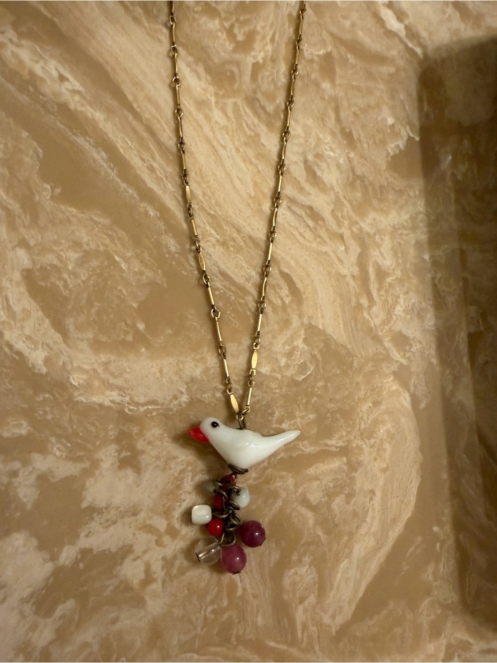 Lenora Dame Gold Chain Necklace with White Bird Pendant and Bead Charms